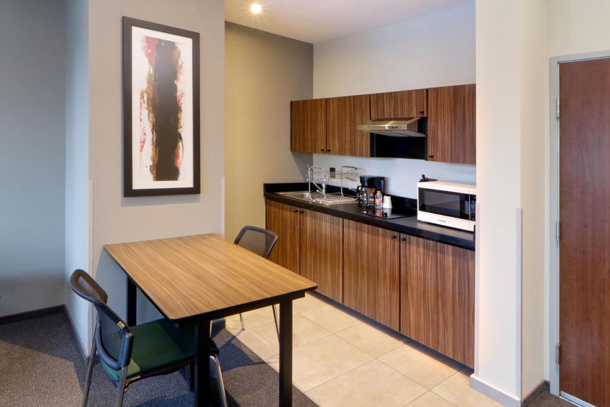 Two-Bedroom Suite with One Queen and Two Double Beds