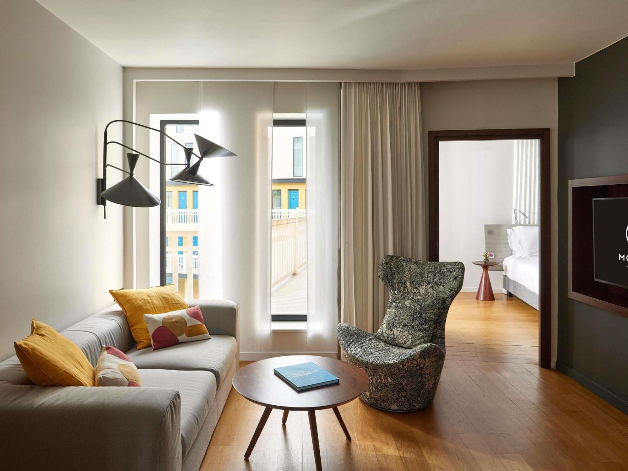 King Suite with Sofa Bed and Lounge Area - Pool View